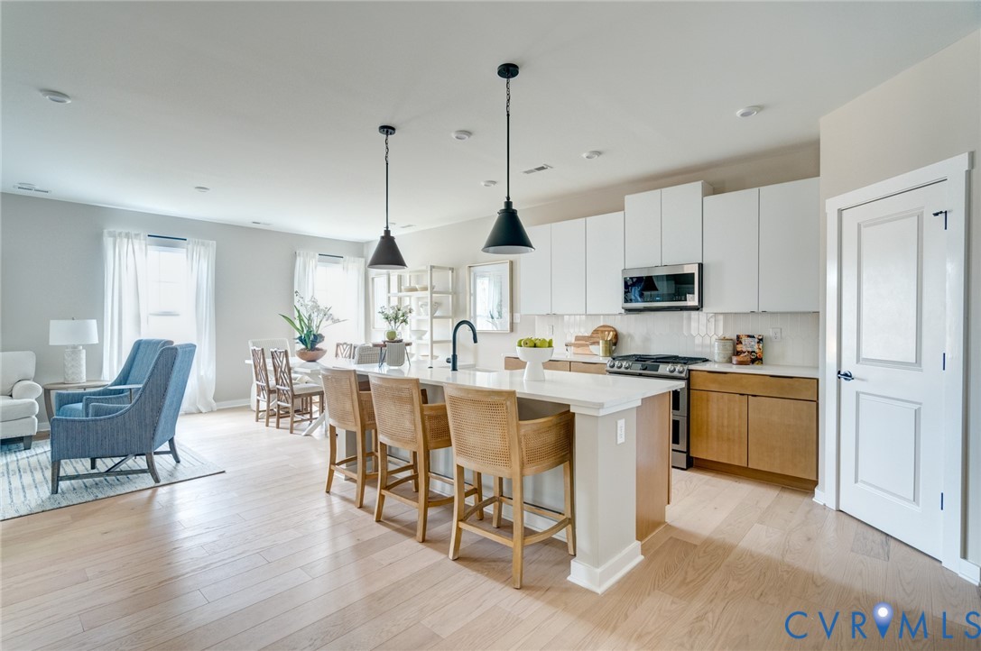 0 Canoe Pointe Loop, Unit 995 Henrico, VA 23238 - Photo 9 of 31 a open kitchen with white cabinets and white appliances