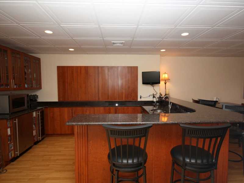 285 Village Road, Unit 285 Tiverton, RI 02878 - Photo 16 of 21 Other. Walk out lower level granite wet bar with wine cooler, refrigerator and tv