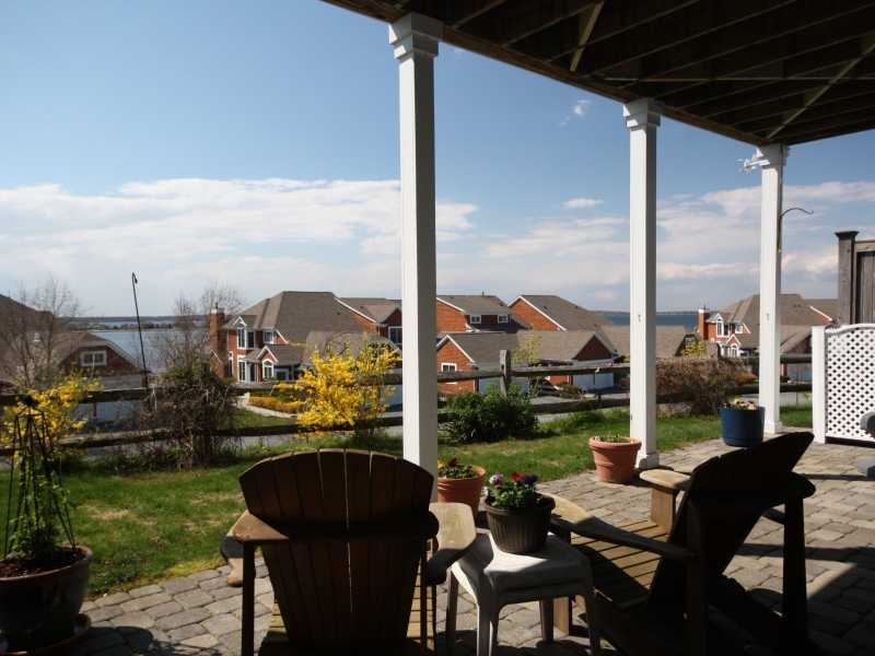 285 Village Road, Unit 285 Tiverton, RI 02878 - Photo 20 of 21 Patio/Deck. Stone patio with views of the Sakonnet River and Mt. Hope Bay
