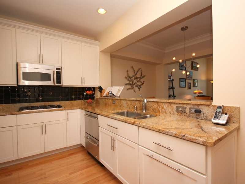 285 Village Road, Unit 285 Tiverton, RI 02878 - Photo 4 of 21 Kitchen. Granite and Stainless Kitchen Opens to Dining Area and Living Room