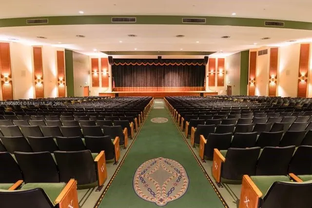 a bathroom with a bathtub and a window