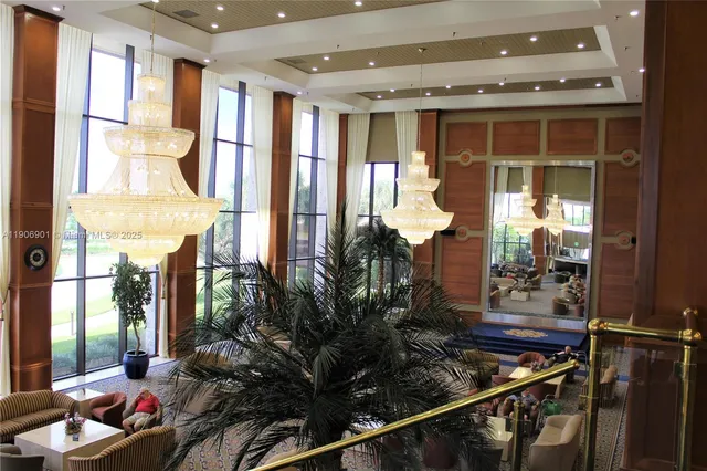 a room with lots of potted plants and glass windows