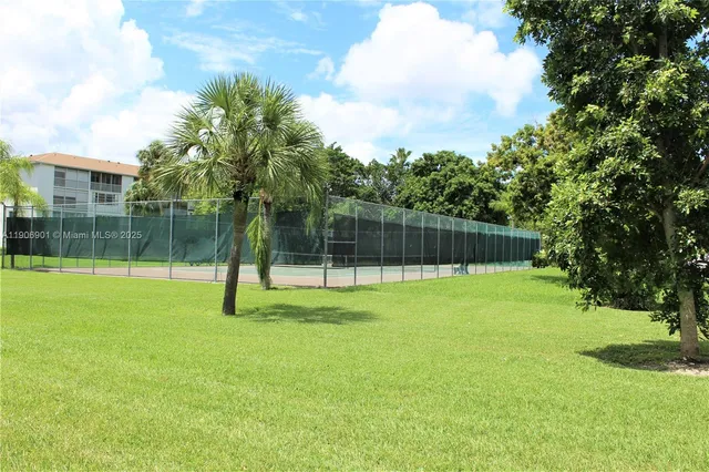 a view of a backyard with a trampoline