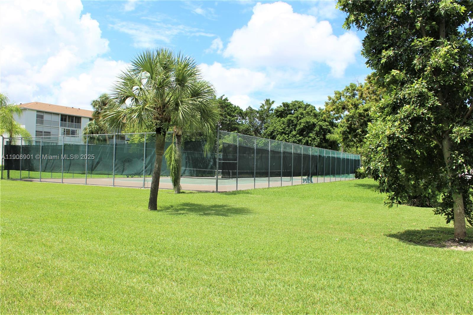 13455 Southwest 3rd Street, Unit 309S Pembroke Pines, FL 33027 - Photo 21 of 23 a view of a backyard with a trampoline