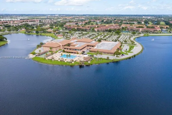an aerial view of a house with a swimming pool