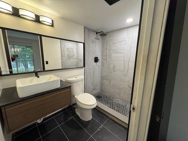 13455 Southwest 3rd Street, Unit 309S Pembroke Pines, FL 33027 - Photo 7 of 23 a bathroom with a sink toilet a mirror and shower