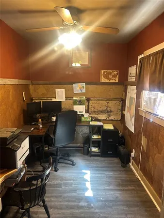 a view of a workspace with furniture