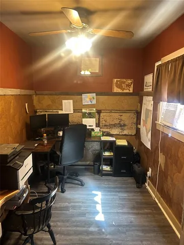 a view of a workspace with furniture