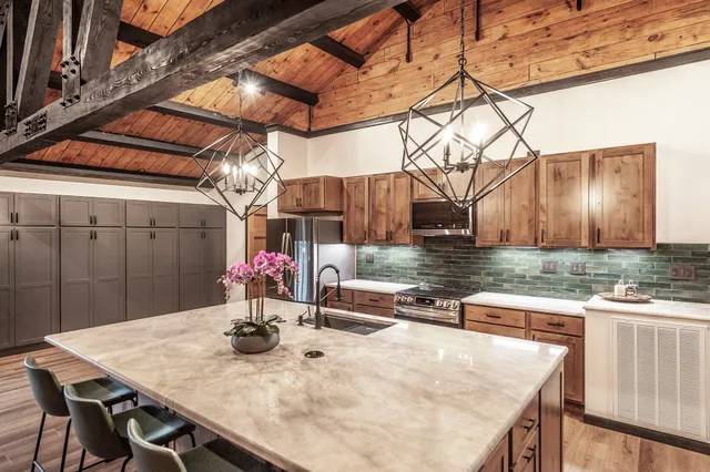a kitchen with a table and chairs in it
