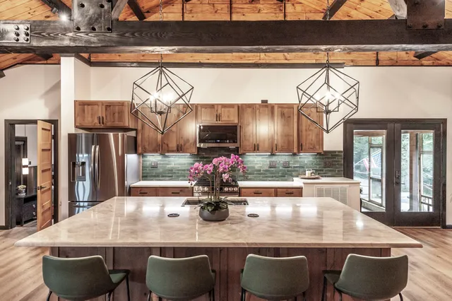 a kitchen with a table and chairs