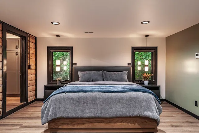 a bathroom with a double vanity sink and mirror