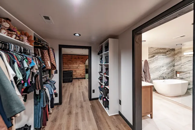 a bathroom with a sink double vanity and a mirror