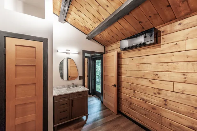 a view of a house with a backyard and sitting area