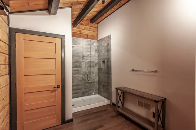 a view of a green field with trees