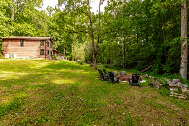 a view of a backyard of the house