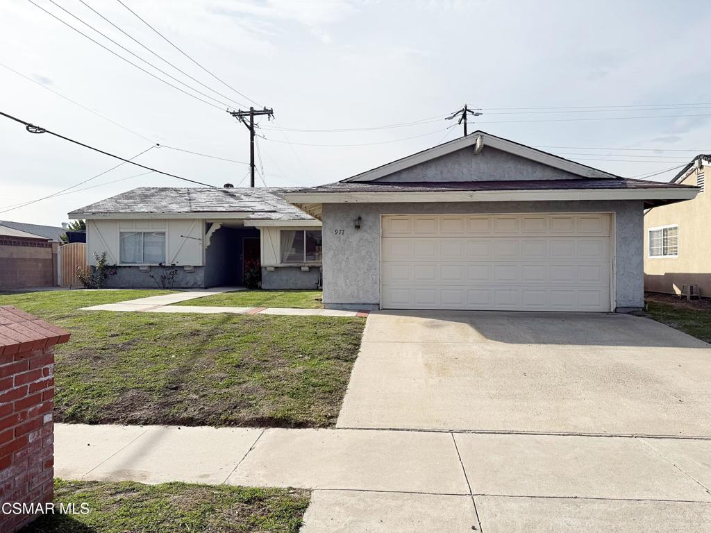 977 Gibson Avenue Simi Valley, CA 93065 - Photo 2 of 7 a front view of a house with a yard