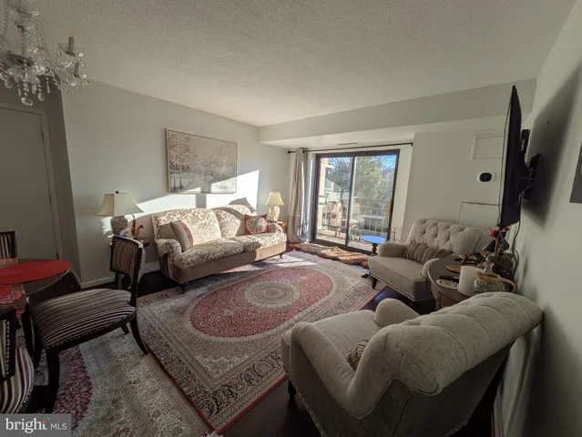 a bedroom with furniture and a flat screen tv
