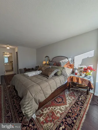 a bedroom with bed and a window