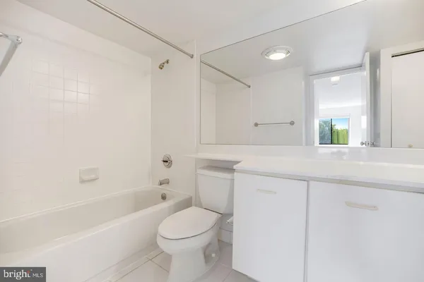 a bathroom with a sink a toilet and a bathtub