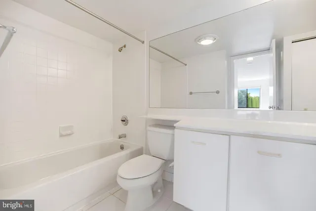 a bathroom with a sink a toilet and a bathtub