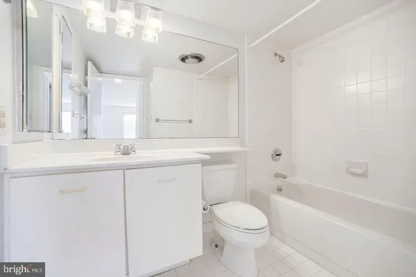 a bathroom with a sink a toilet and a bathtub