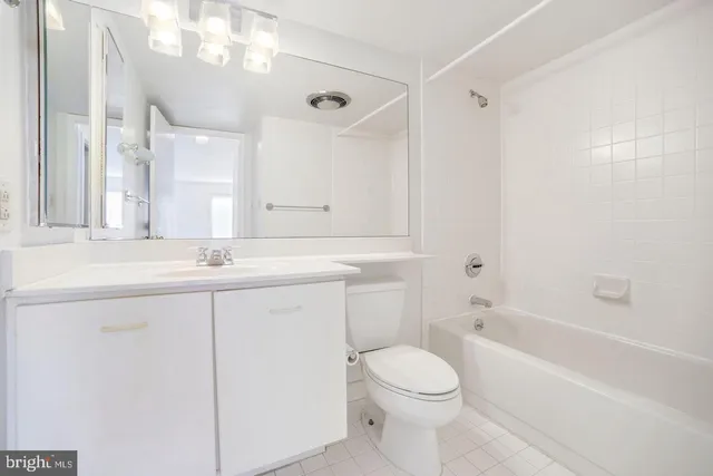 a bathroom with a sink a toilet and a bathtub