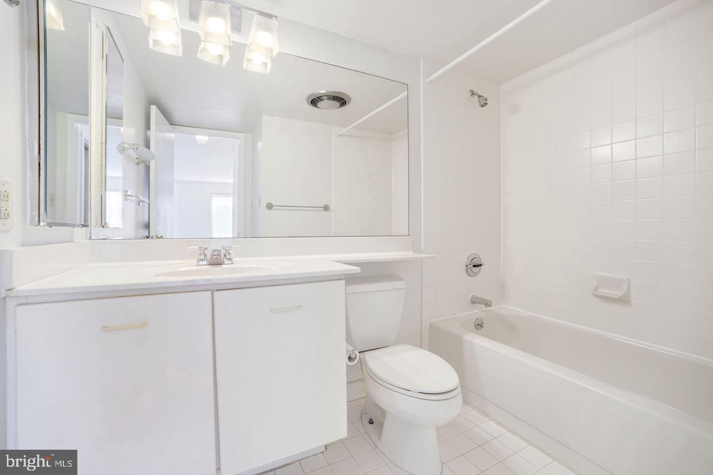2111 Wisconsin Avenue Northwest, Unit 317 Washington, DC 20007 - Photo 22 of 38 a bathroom with a sink a toilet and a bathtub