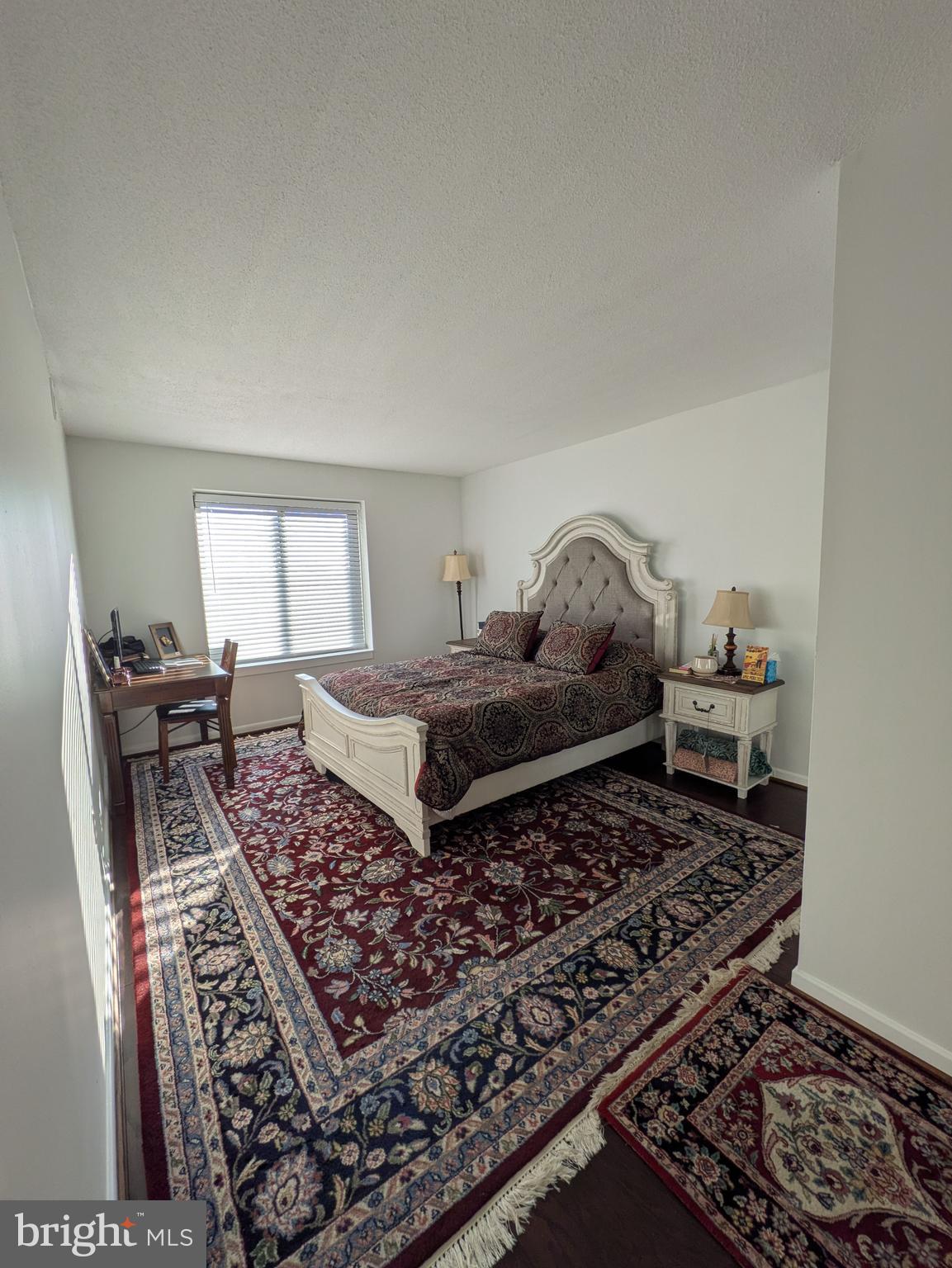 2111 Wisconsin Avenue Northwest, Unit 317 Washington, DC 20007 - Photo 23 of 38 a living room with furniture and a rug
