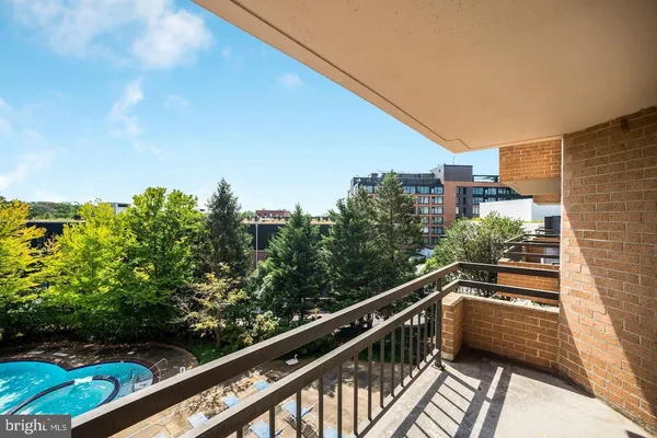 a view of balcony with furniture