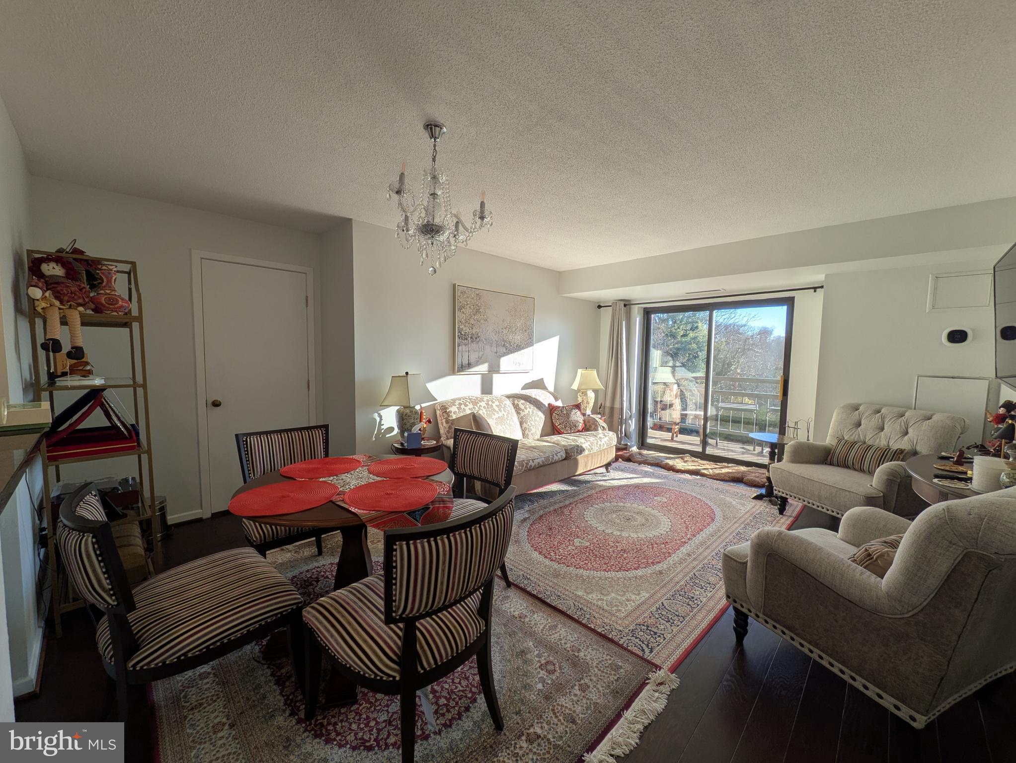2111 Wisconsin Avenue Northwest, Unit 317 Washington, DC 20007 - Photo 3 of 38 a living room with furniture a couch and a window