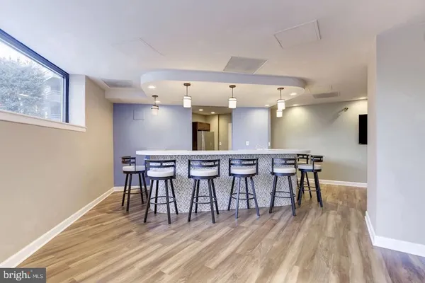 a view of a dining room with furniture and wooden floor