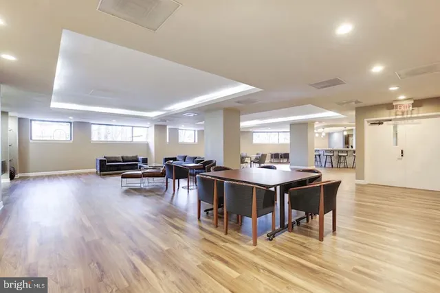 a view of a dining room with furniture window and wooden floor