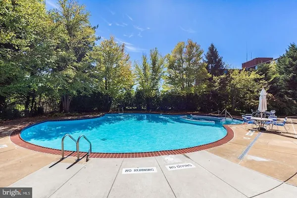 a view of a swimming pool with a patio