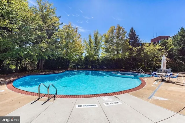 a view of a swimming pool with a patio