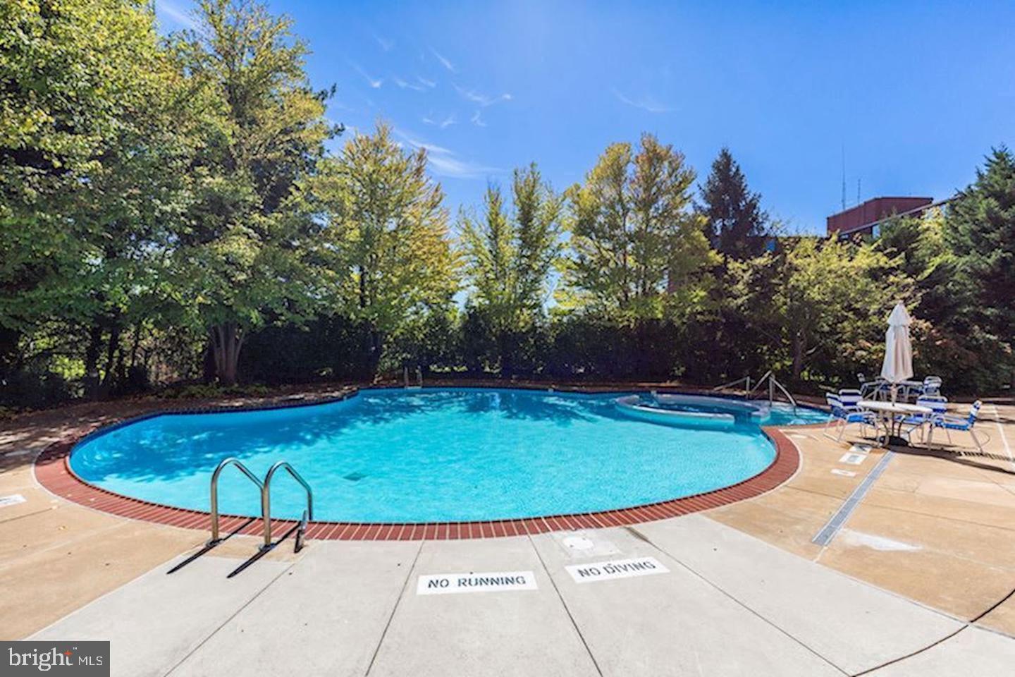 2111 Wisconsin Avenue Northwest, Unit 317 Washington, DC 20007 - Photo 36 of 38 a view of a swimming pool with a patio