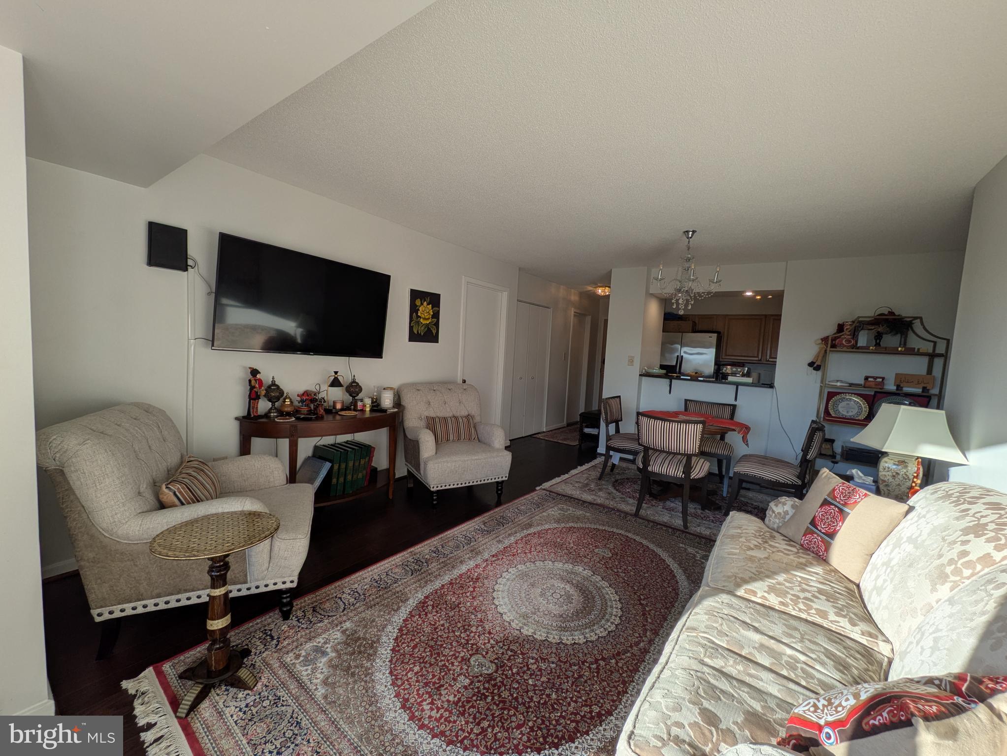 2111 Wisconsin Avenue Northwest, Unit 317 Washington, DC 20007 - Photo 7 of 38 a living room with furniture and a flat screen tv