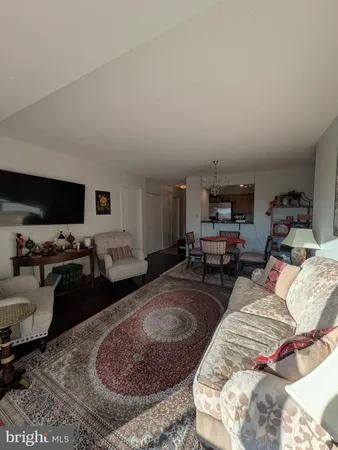 a bed room with furniture and a flat screen tv