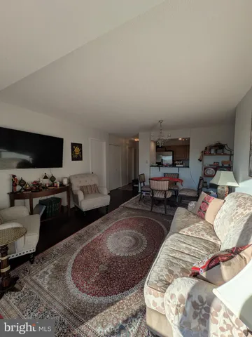 a bed room with furniture and a flat screen tv