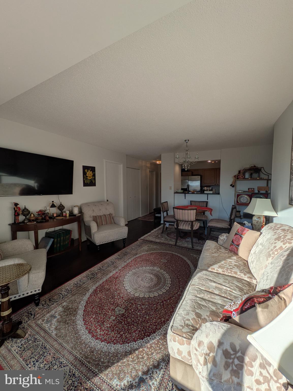 2111 Wisconsin Avenue Northwest, Unit 317 Washington, DC 20007 - Photo 8 of 38 a bed room with furniture and a flat screen tv
