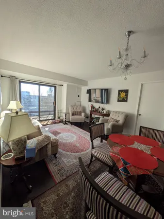 a spacious bedroom with two beds and a large window