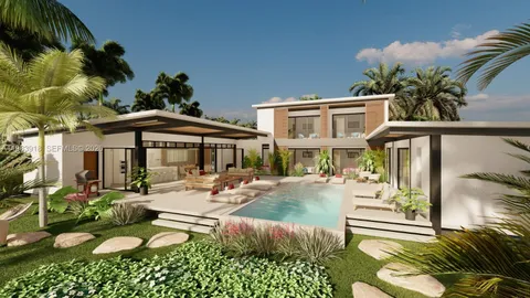 a view of a house with backyard and sitting area