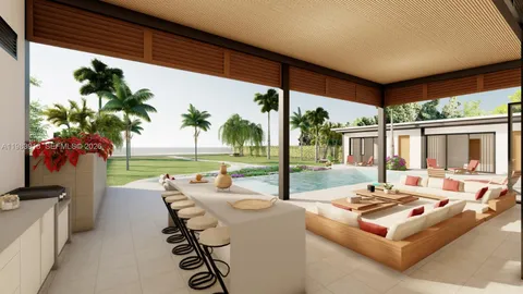 a living room with patio furniture and a potted plants