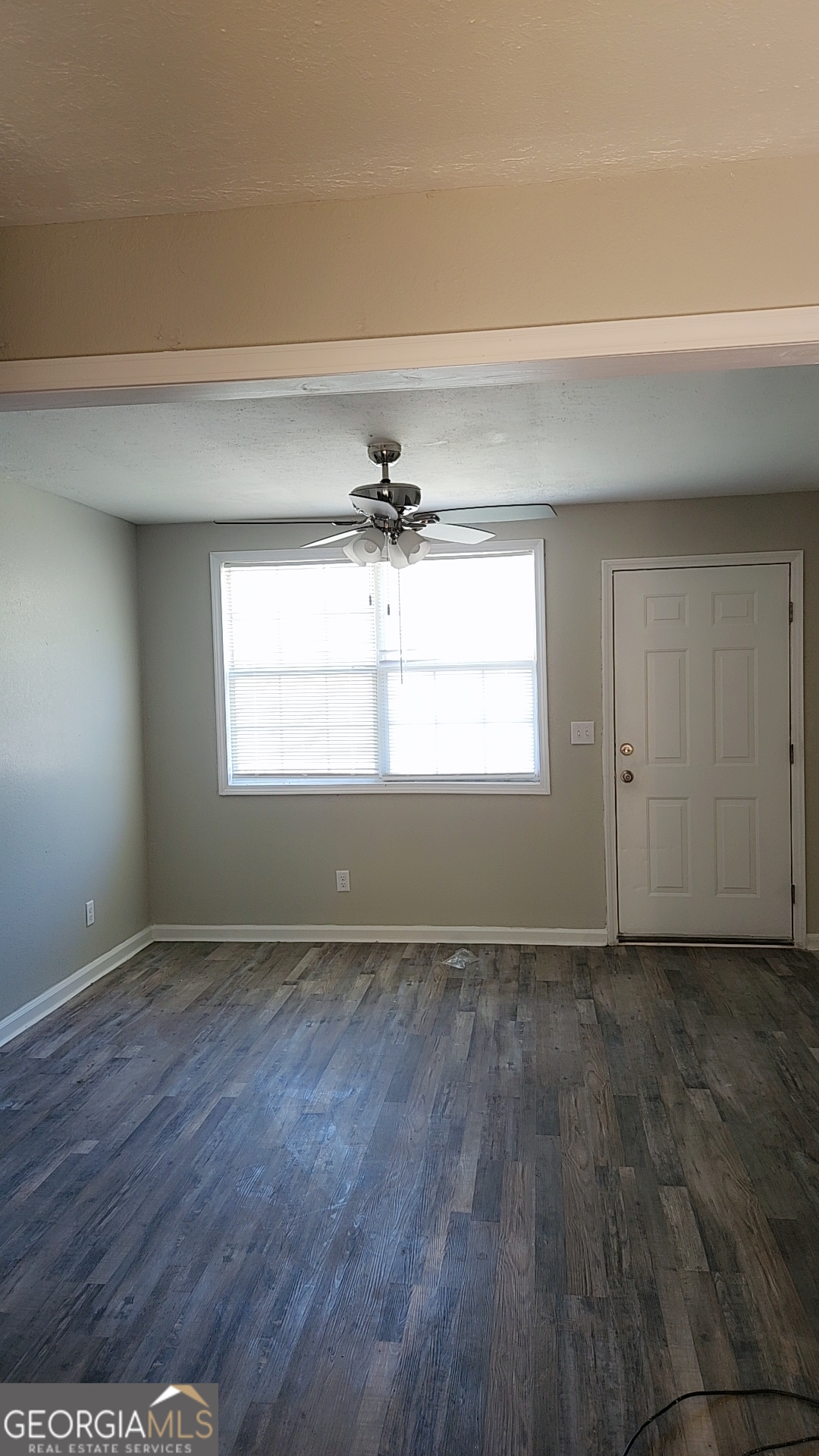 164 Davis Street Southeast Camilla, GA 31730 - Photo 2 of 10 a view of an empty room with a window