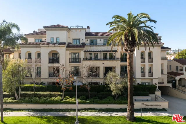a front view of a house with swimming pool and porch