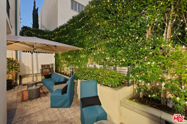 a patio with table and chairs