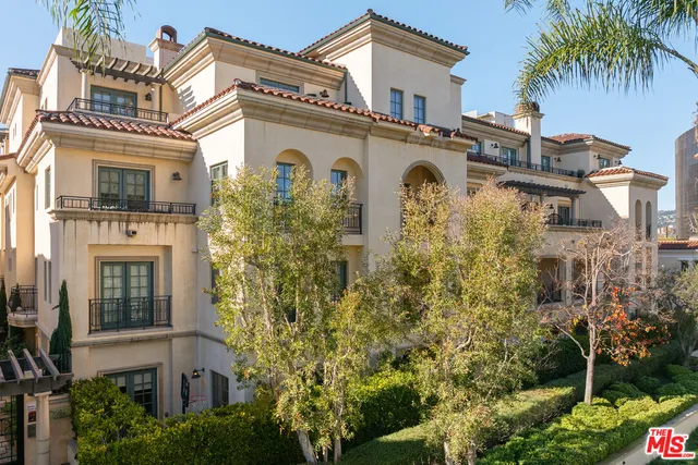 a view of multiple houses with a city street