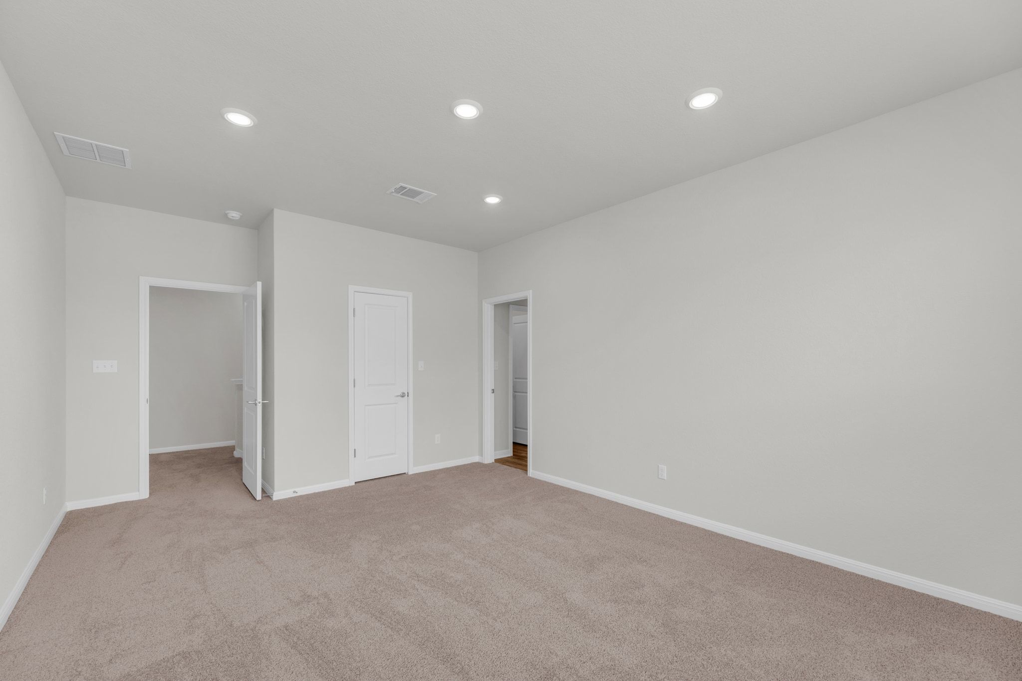 1015 Vista View Drive, Unit 101 Georgetown, TX 78626 - Photo 15 of 40 Unfurnished bedroom featuring light colored carpet and recessed lighting