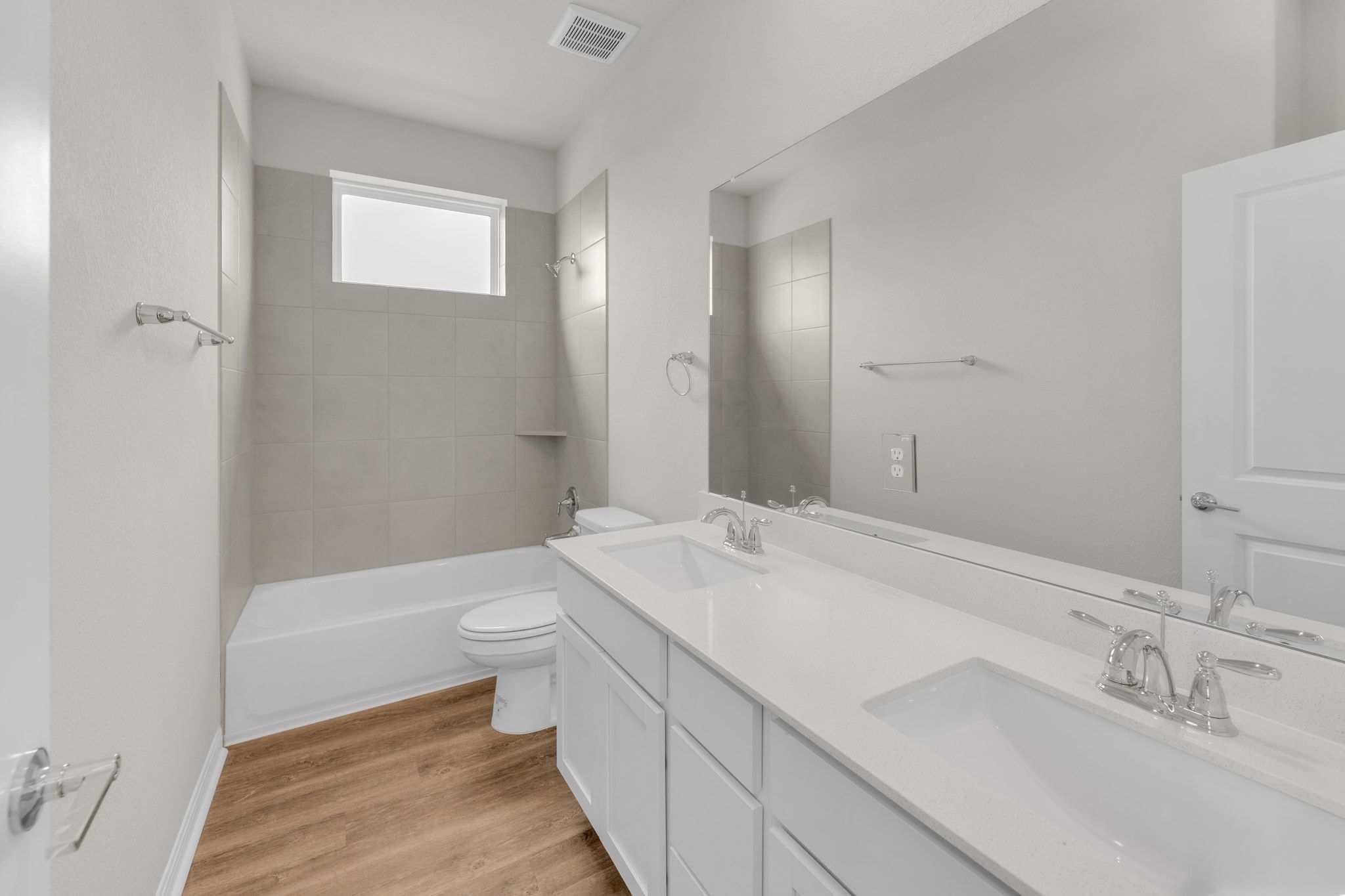1015 Vista View Drive, Unit 101 Georgetown, TX 78626 - Photo 21 of 40 Bathroom featuring double vanity, bathtub / shower combination, and light wood-type flooring