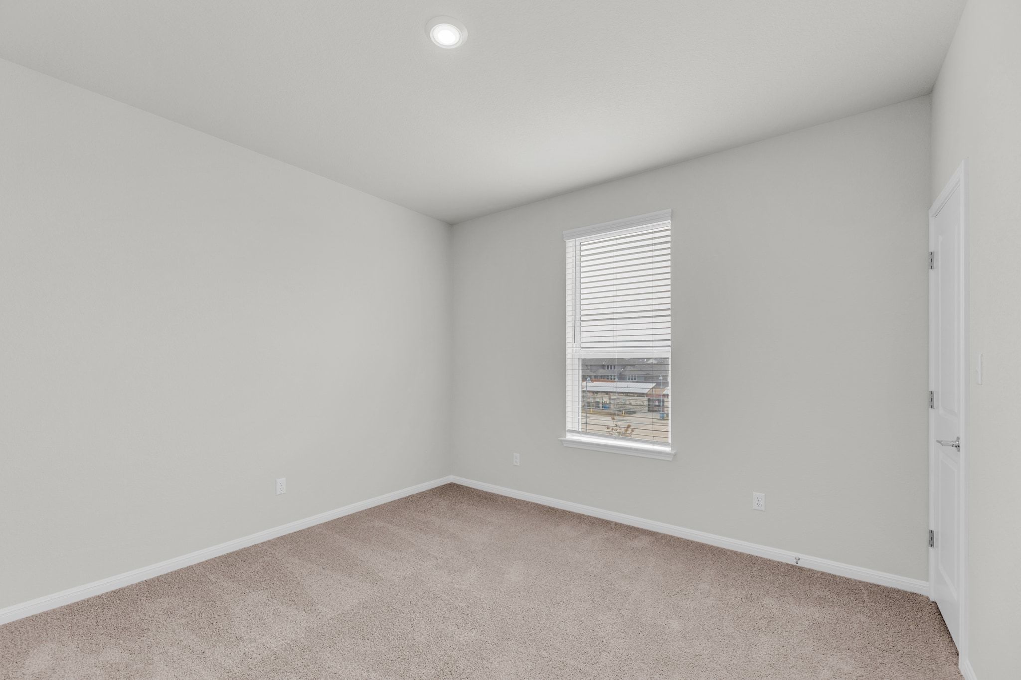 1015 Vista View Drive, Unit 101 Georgetown, TX 78626 - Photo 24 of 40 Empty room featuring light carpet and baseboards