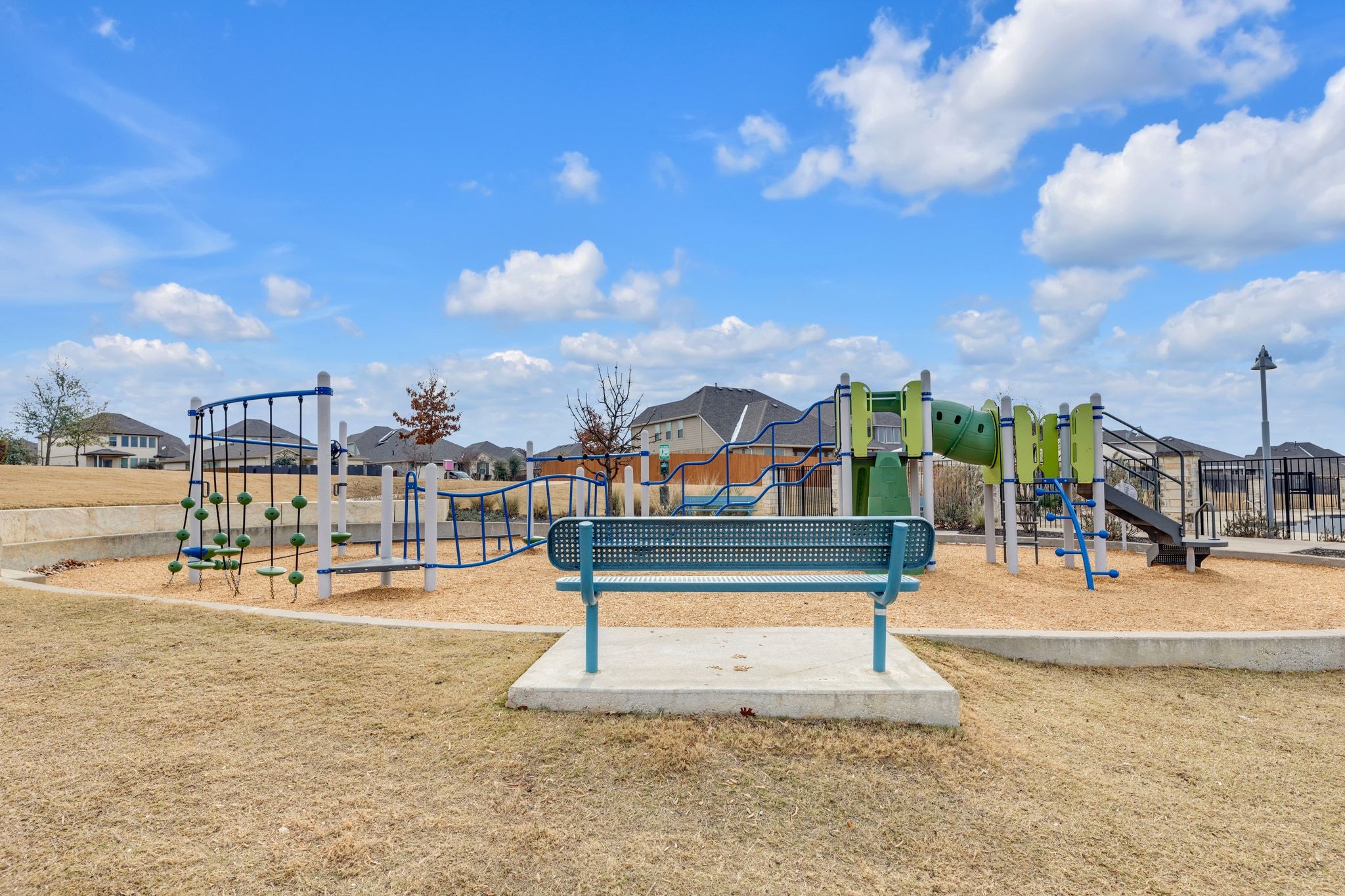 1015 Vista View Drive, Unit 101 Georgetown, TX 78626 - Photo 31 of 40 Communal playground featuring a residential view